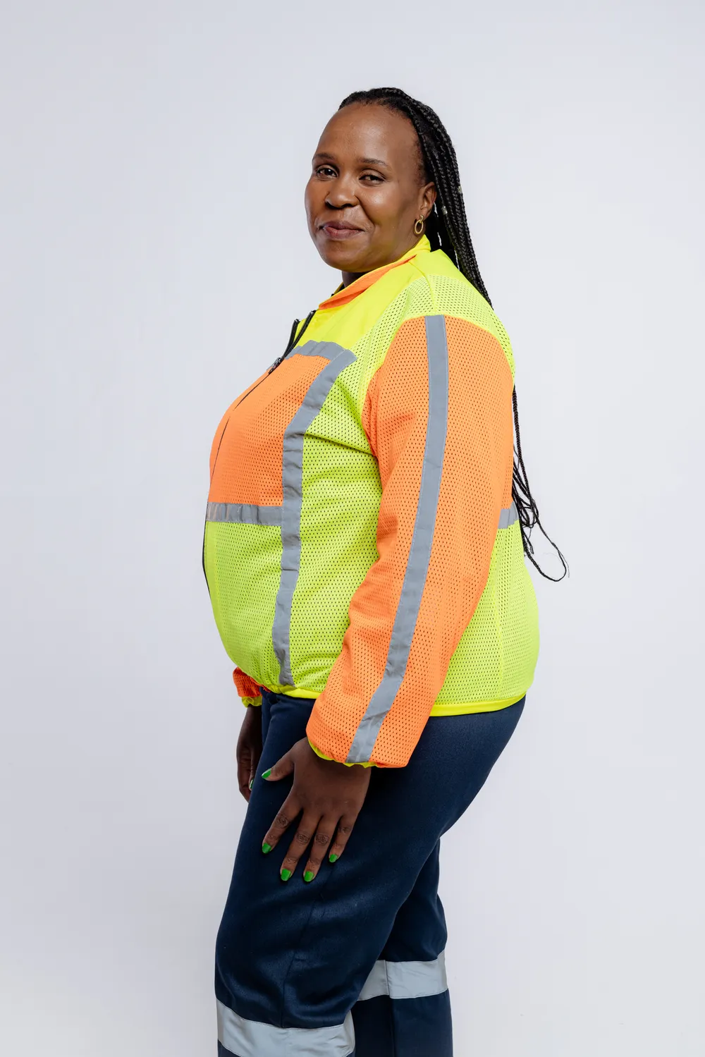 A Mabhena worker in a high-visibility reflective jacket